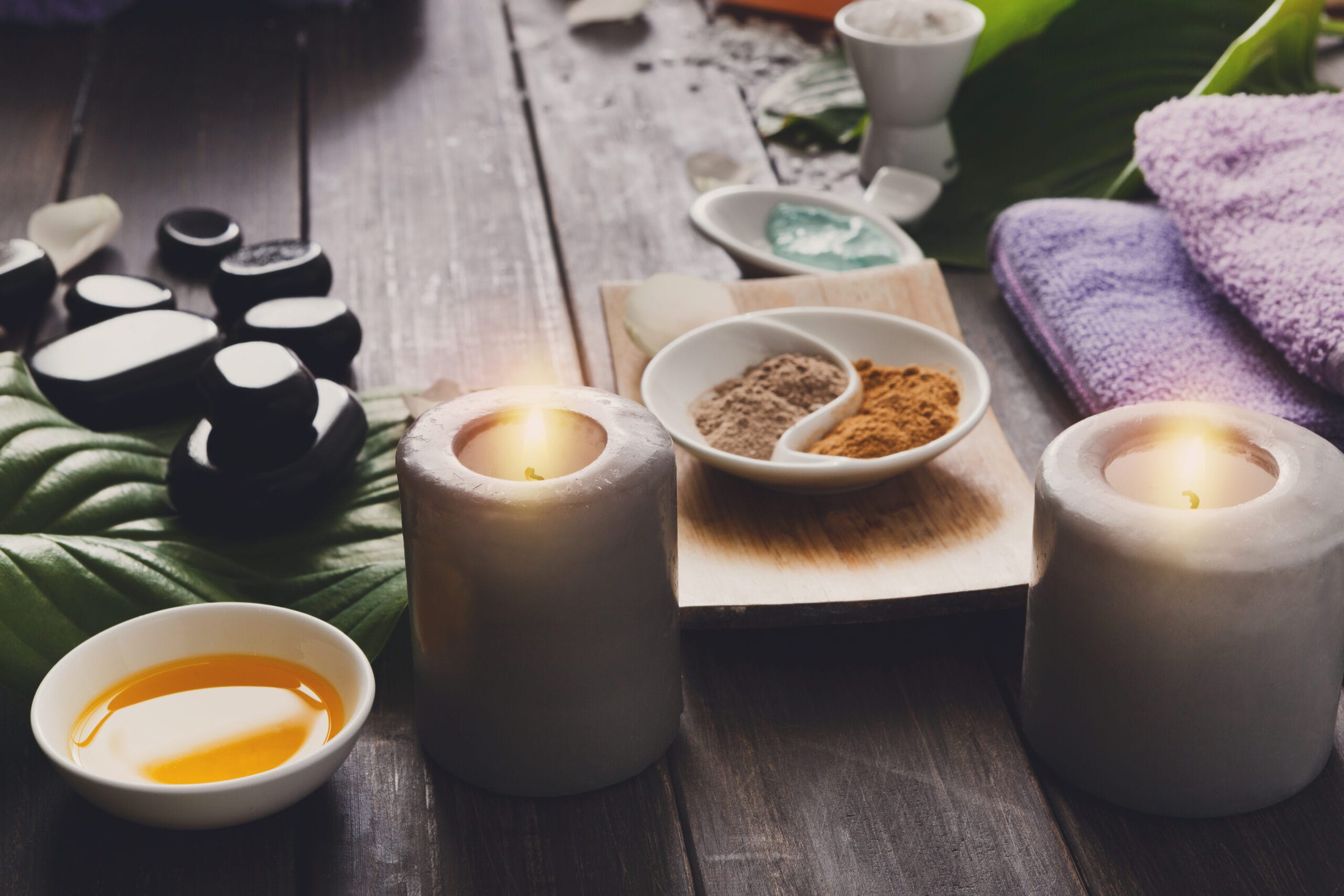 Spa treatment, aromatherapy background. Details and accessories Spa treatment and aromatherapy concept background. Zen stones, aroma salt, spices, burning candle, oil and soap, candle and other details of wellness body care and alternative indian medicine.